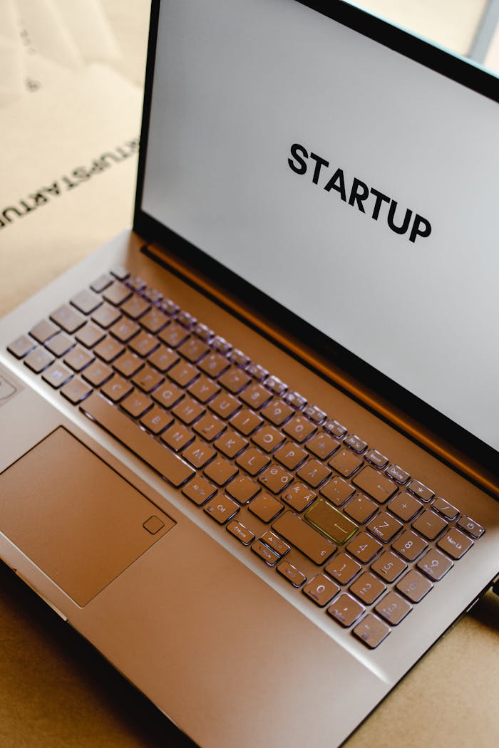 contact-img Sleek laptop displaying the word 'STARTUP', ideal for tech and business themes.